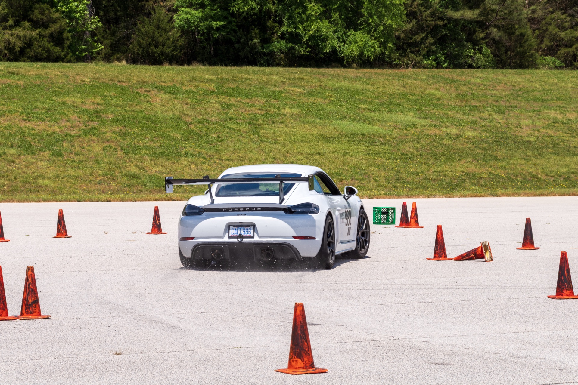 Cayman GT4 number 988 rear view between autocross cones at Michelin Proving Grounds
